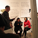 Jesse leading a song at the CAC Under Island singing